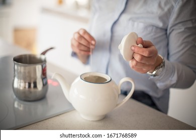 Morning Time Is Teatime. Woman In The Kitchen Making Tea. Close Up.