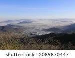 Morning view of foggy farming village seen from Jeongnyeongchi Pass of Jirisan National Park in spring near Namwon-si, South Korea
