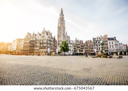 Morning view on the Grote Markt with beautiful buildings and church tower in Antwerpen city, Belgium