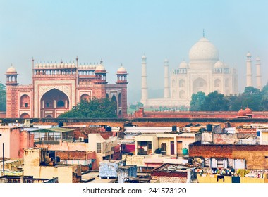 Morning view at residential quarter in Agra with Great gate (Darwaza-i rauza) and Taj Mahal as a backdrop - Powered by Shutterstock