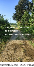 Morning view of small village street with  inspirational dan motivational quotes - The road of success is outside of the comfort zone.