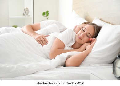 Morning of young couple sleeping in bed - Powered by Shutterstock