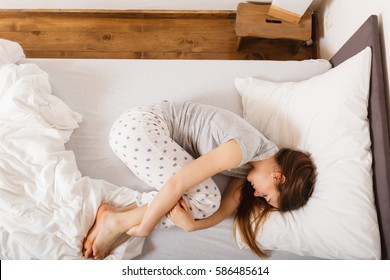 Mornings People Concept. Sleepy Woman Sleeping In The Bed. Attractive Lady Changing Sleep Positions.