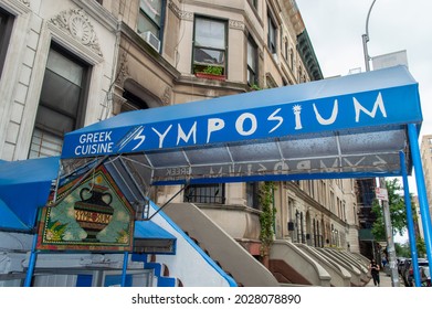 Morningside Heights, New York, NY, USA - August 19, 2021: Blue Awning Of Symposium, A Greek Restaurant Near Columbia University (544 W 113th Street)