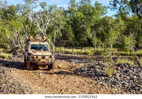 Mornington, Western\
Australia - July 24, 2010: An off road vehicle drives through the\
Mornington Wildlife Sanctuary in the outback Kimberley region of\
Western Australia.