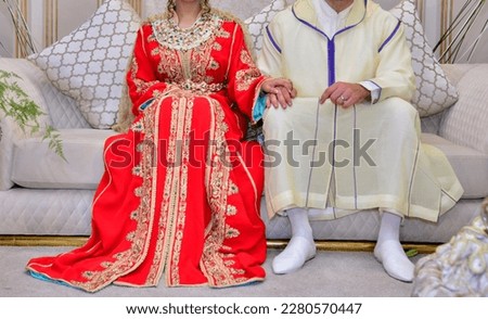 Moroccan bride and groom. The bride wears the Moroccan caftan and the groom wears the Moroccan djellaba