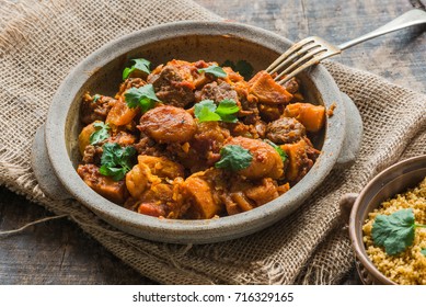 الطبخ المغربي الطحين المغربي Moroccan-lamb-tajine-couscous-garnished-260nw-716329165
