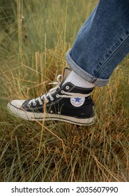 Morocco - August 20, 2021; Black Converse Shoe With White Socks With Autumn Vibe Nature In The Background