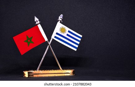 Morocco and Uruguay table flag with black Background