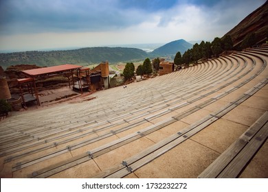 Morrison, Colorado/USA - 05.04.2015: Red rocks park and amphitheater, view from the benches to the stage, wide angle, on a day with no rock concert, empty stage and no audience.