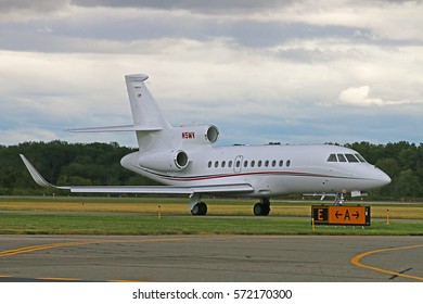 MORRISTOWN, NEW JERSEY - SEPTEMBER 6, 2016: A 2008 Dassault Falcon 900EX With Marking N5MV Taxiing Toward The Runway To Take Off From Morristown Municipal Airport In New Jersey.