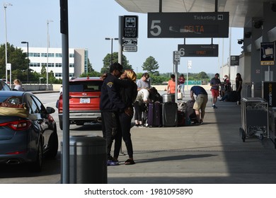 Morrisville, NC - United States- 05-27-2021: An African American Couple Says Goodbye At The Curb Of RDU International Airport. 