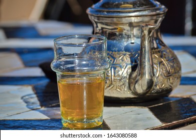 Morrocan Green Tea In Glass A Traditional Jug With Mint In Marrakech