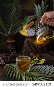 Morrocan Tea In Glass With Orange, Cinnamon, Mint, Lemon African Style Brown Texture Background 