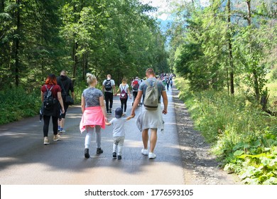 Morskie Oko, Poland - August 08, 2019: Crowd In Road To Morskie Oko. Many People Walking On Footpath To Famous Place In Tatra Mountains. Many Tourist.