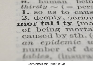 Mortality dictionary definition close-up. Shallow depth of field. - Shutterstock ID 2106436190