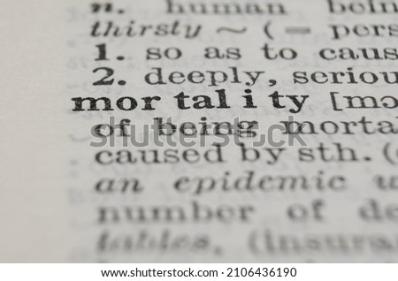 Mortality dictionary definition close-up. Shallow depth of field.