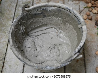 Mortar in cement tub ready to coat - Shutterstock ID 1073589575