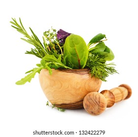 Mortar with fresh herbs isolated on white background
