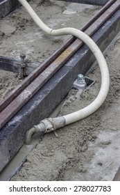 Mortar From Grout Mixer And Delivery System, Grouting Pump Used To Settle The Grout Into The Joints. Grouting Mortar And Tram Track Laying.  Selective Focus And Shallow Dof. 