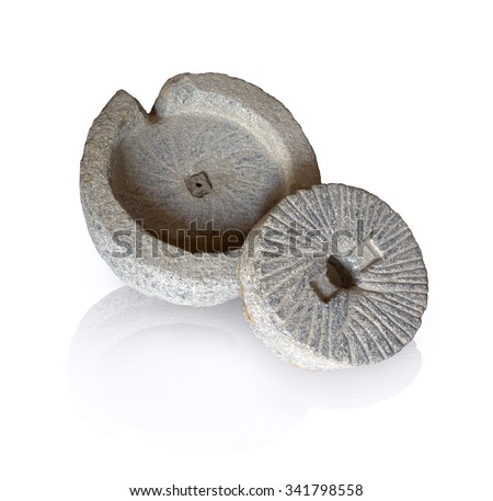Mortar hewn aged grunge millwheel with handle and hole for processing seeds, fruits into farina powder, oil, spice for cooking isolated on white backdrop. Close-up view with space for text