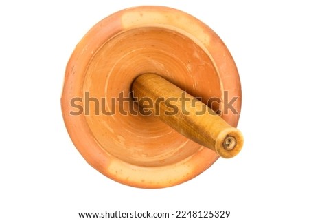 Mortar and Pestle isolated on white background.mortar is a tool for finely grinding herbs in Asian cuisine.handmade earthenware mortar.top view.