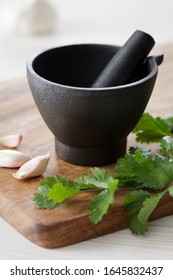 Mortar And Pestle With Spices And Herbs