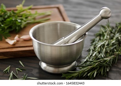 Mortar And Pestle With Spices And Herbs