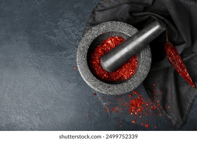 Mortar and pestle with spices on dark background - Powered by Shutterstock