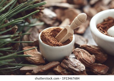 Mortar Of Powdered Pine Bark, Branches Of Pine Tree And Dry Pine Bark On Wooden Board.