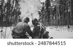 Mortar Shooting Explosions. Back View On Re-enactors Dressed As American Infantry Soldiers Fire From Mortar. Usa Army Soldiers Of World War Ii. Reconstruction Defense Battles. Heroes Of War. Black And