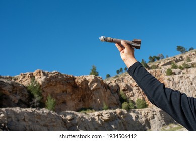 Mortar Weapon Bomb In Man Hands On Nature Background.