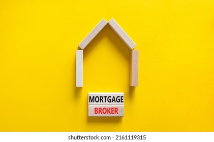 Mortgage Broker Symbol. Concept Words 'Mortgage Broker' On Wooden Blocks Near Miniature Wooden House. Beautiful Yellow Background. Business, Mortgage Broker Concept.