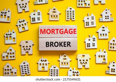 Mortgage Broker Symbol. Concept Words 'Mortgage Broker' On Wooden Blocks Near Miniature Wooden Houses. Beautiful Yellow Background. Business, Mortgage Broker Concept.