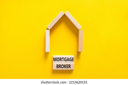 Mortgage Broker Symbol. Concept Words 'Mortgage Broker' On Wooden Blocks Near Miniature Wooden House. Beautiful Yellow Background. Business, Mortgage Broker Concept.