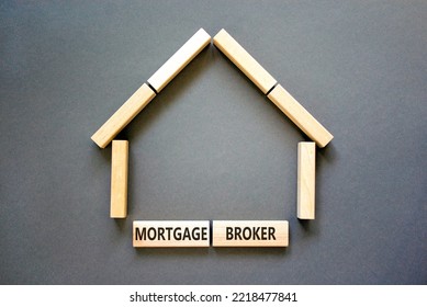 Mortgage Broker Symbol. Concept Words 'Mortgage Broker' On Wooden Blocks Near Miniature Wooden House. Beautiful Grey Background. Business, Mortgage Broker Concept.