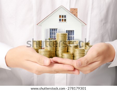 Mortgage concept by money house from the coins