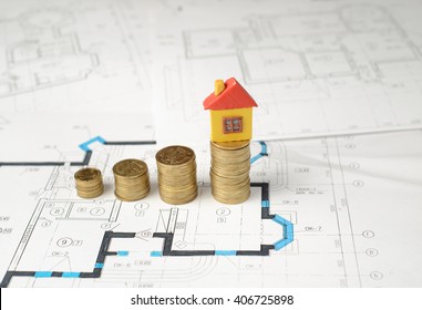 Mortgage Concept By New House On Hill From The Coins On Paper Blueprints