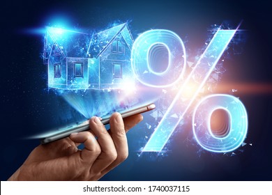Mortgage concept for housing mortgage interest rates. Male hand with tablet and hologram at home and percent sign. Copy space, mixed media