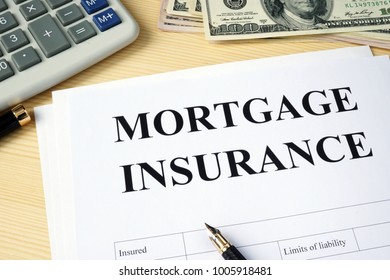 Mortgage Insurance Policy On A Desk.