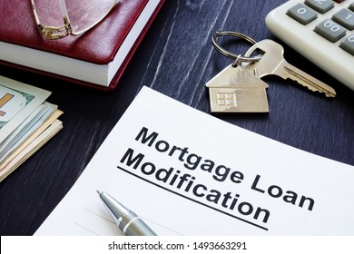 Mortgage Loan Modification agreement and keys from home. - Shutterstock ID 1493663291