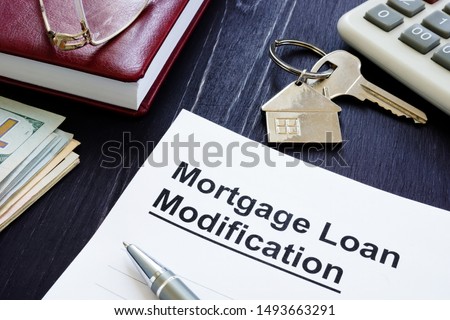Mortgage Loan Modification agreement and keys from home.