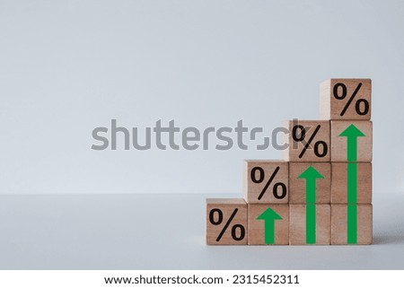 Mortgage rates,Interest rates,tax,real estate,business growth concept.,Wooden blocks stacked as stair with percent icon over white background for financial,business idea.