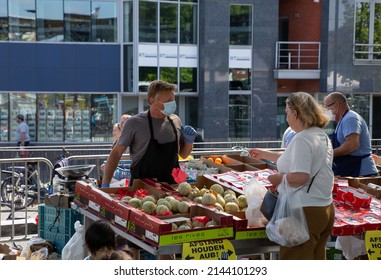 Mortsel, Antwerp, Belgium 3 June 2020 : Fruit And Vegetable Vendor At Market Wearing Face Mask And Gloves During Covid Pandemic