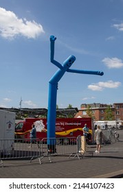 Mortsel, Antwerp, Belgium 3 June 2020 : Blue Inflatable Man, Also Called Sky Dancer, Fly Guy, Tall Boy, Tube Man, Or Wacky Waving Inflatable Air Dancer Over People At Market In Mortsel 