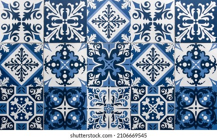 A mosaic of blue and white geometric patterned ceramic tiles. Typically found on the frontage of traditional Chinese shop houses throughout Asia.  - Shutterstock ID 2106669545