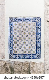 Mosaic detail in a wall in Alfama district in Lisbon Portugal - Shutterstock ID 485862874
