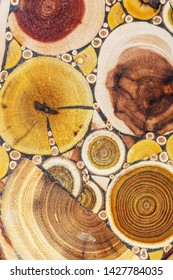 Mosaic of different types of trees. Decorative wooden board with a heartwood.