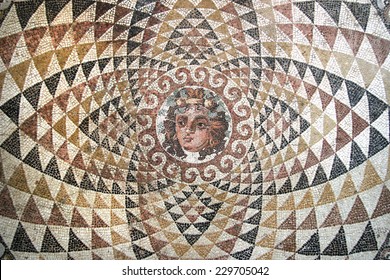 Mosaic of Dionysos, from the ruins of central panel from tesselated floor of a Roman villa (second half 2nd Century BCE). Depicted is Dionysos with fruit and ivy in his hair. Corinth, Greece. 