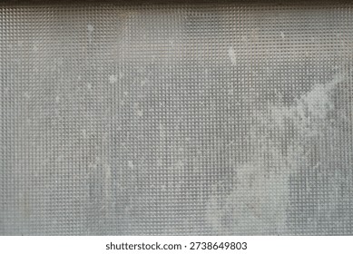 mosaic pattern on a dirty window glass                                  